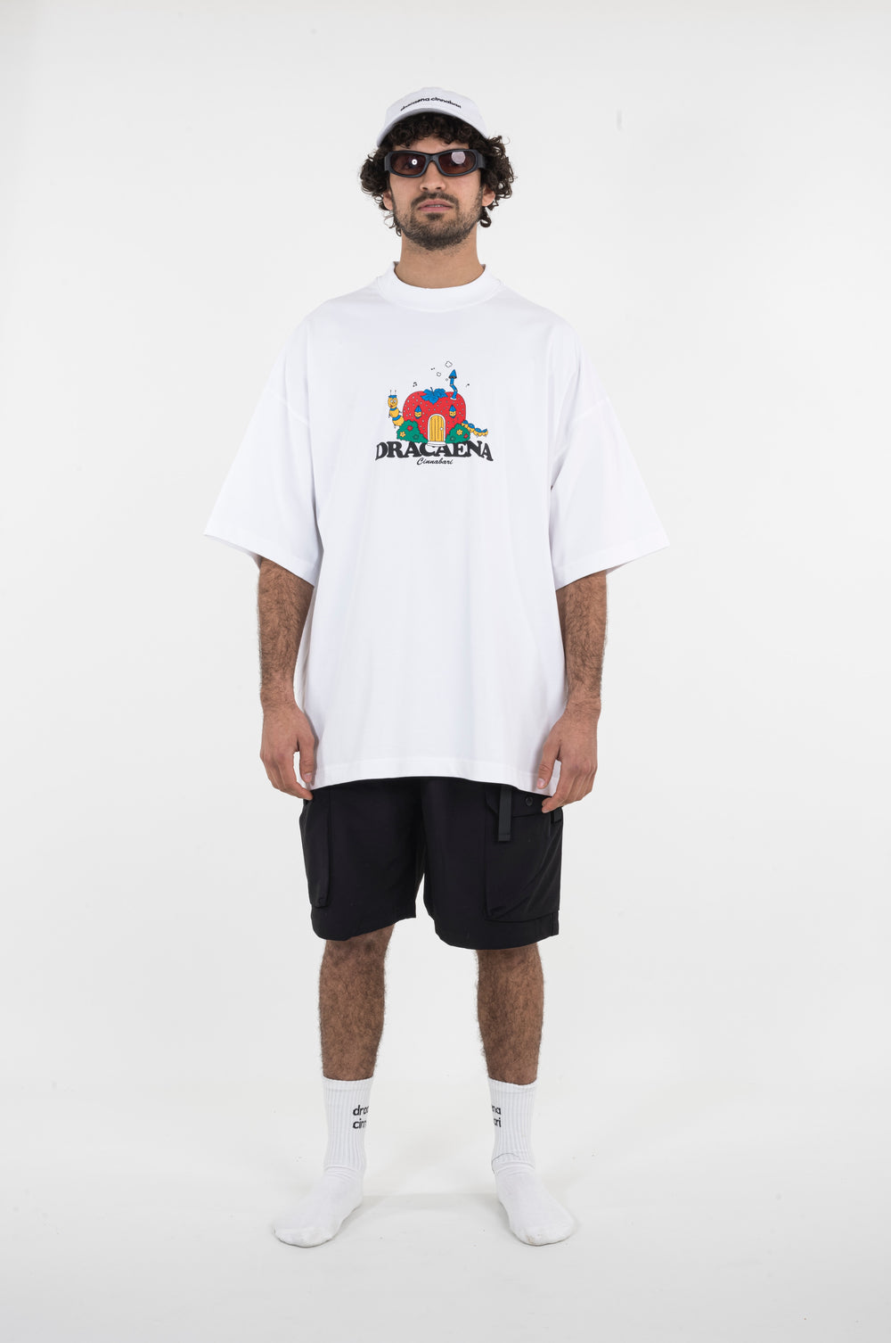 An oversized white T-shirt with a strawberry print