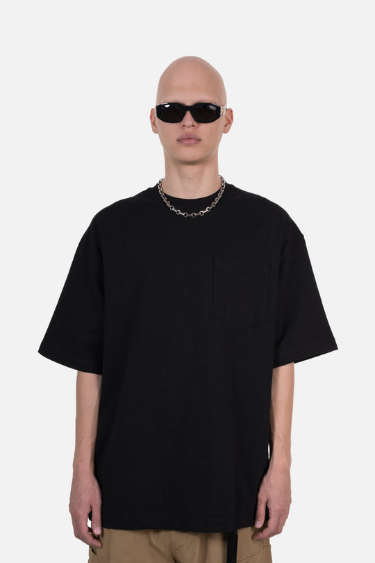 An oversized black T-shirt with a front pocket