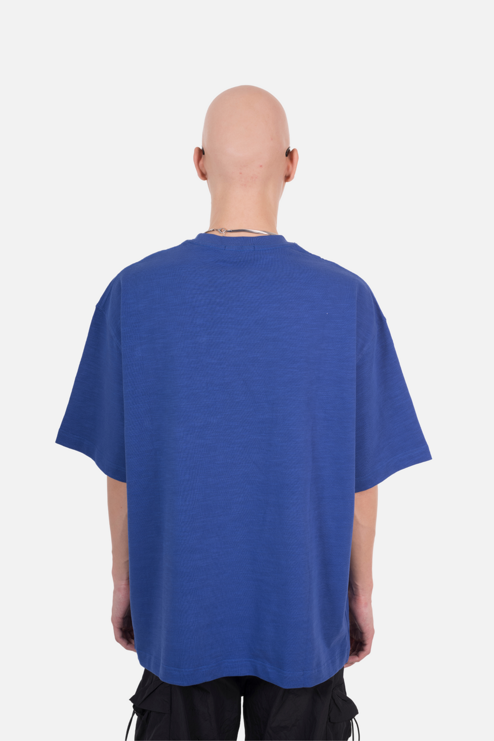 An oversized blue T-shirt with a front pocket