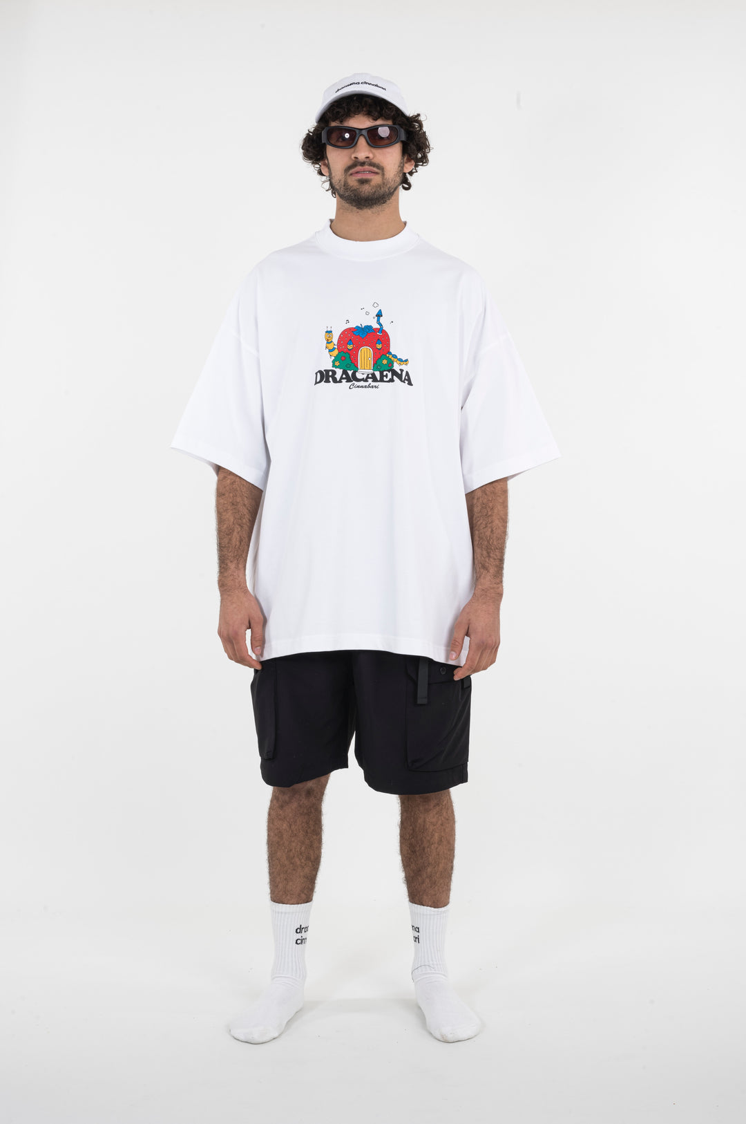 An oversized white T-shirt with a strawberry print